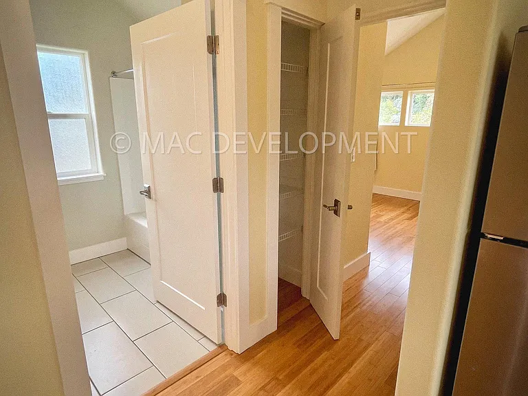 Hallway with closet, access to bathroom and bedroom