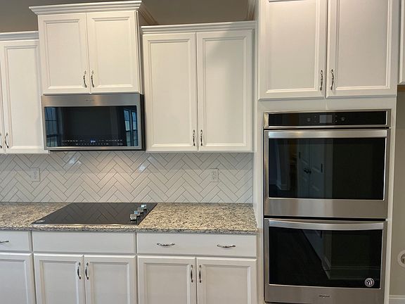 The Claremont 157 Edmer Lane Herringbone Tile Backsplash