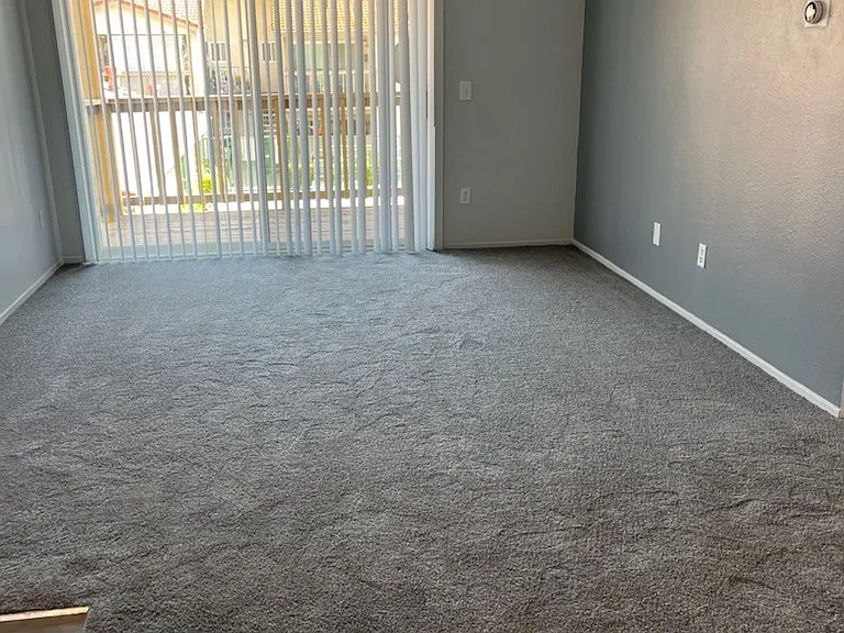 Large livingroom with a private balcony or private patio