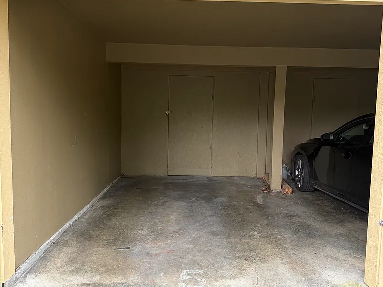 personal covered parking spot with locked storage in rear