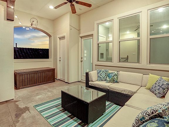 The covered rooftop terrace has plenty of room for furniture and prewire for a TV.