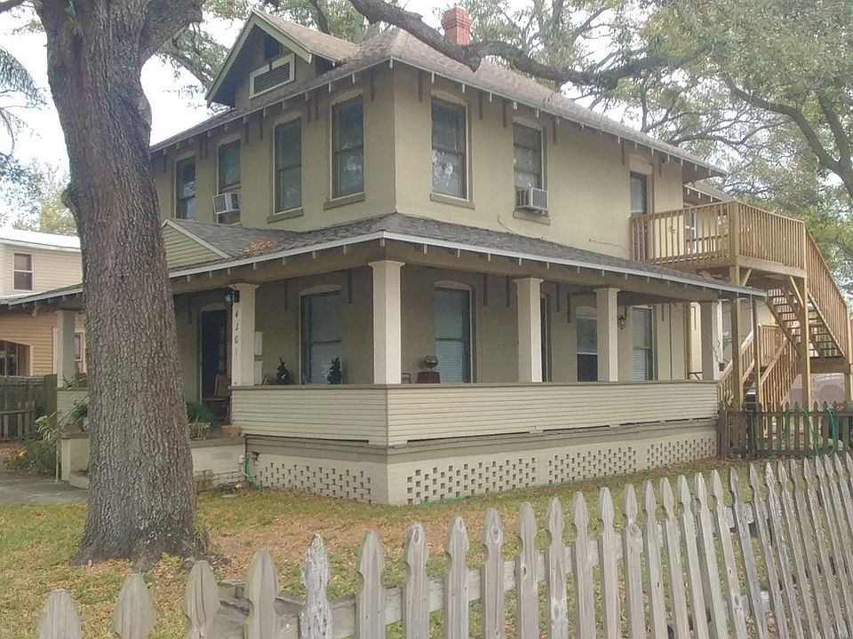 1920 Brick Bungalow with wrap around porch. Upstairs apartment that has views on 3 sides of house. 3 other occupied, different sized, separate apartments. Each having 2 entrance doors.