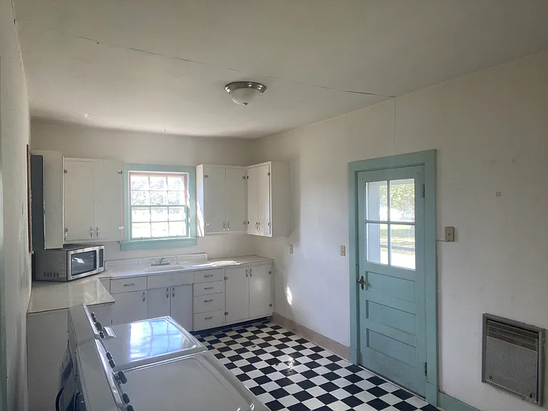 Kitchen looking at side entry