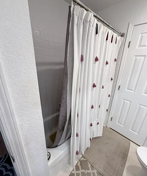 Master bathroom upstairs with bathtub