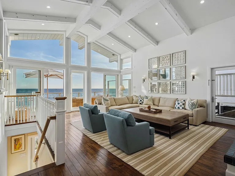 Floor-to-ceiling windows open to endless horizons.