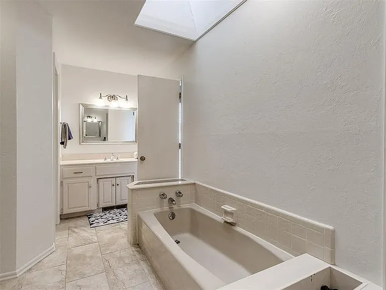 Master bath double tub and vanity.