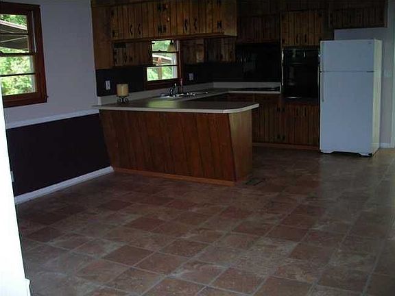 The kitchen and dining room combination is huge and has newer laminate floorin
