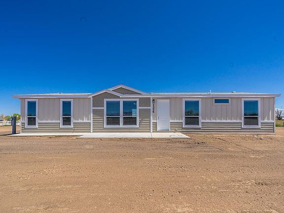 Upgraded siding, trim, eaves, concrete patio, Low-E energy efficient windows, ground set with concrete block stem wall!