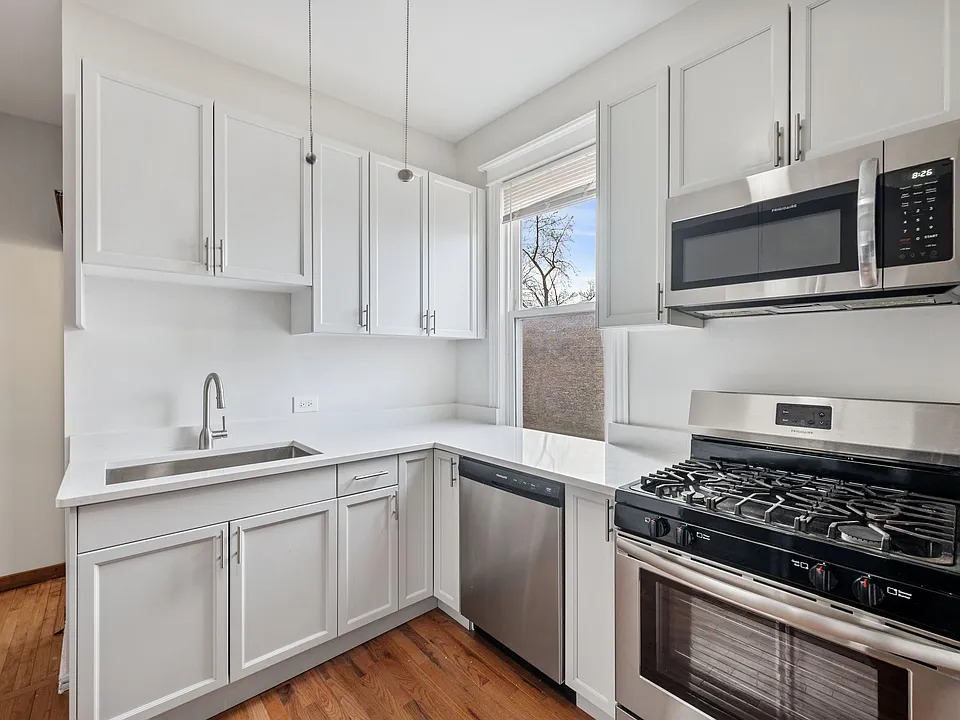 Newly renovated kitchen with ample counter space and storage.