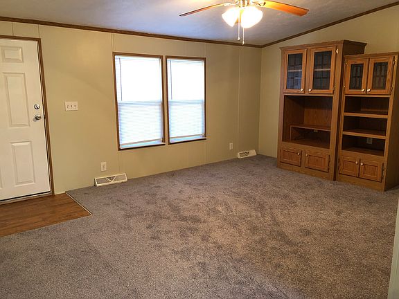 front room; master bedroom off right of built-ins