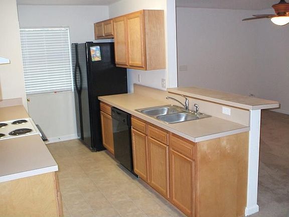 Kitchen with appliances and bar