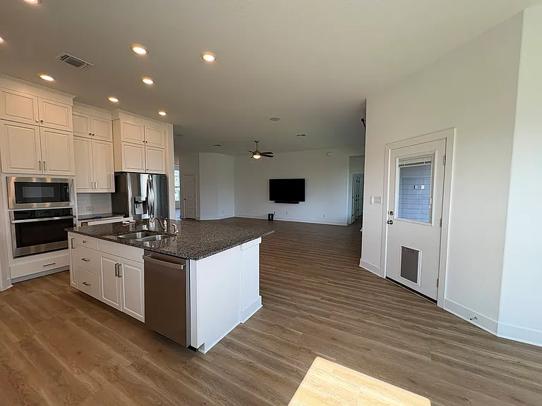 Open concept kitchen, living and dining