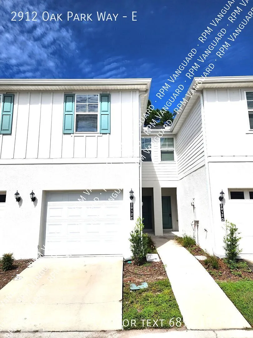 Freshly Painted Two-Story Townhouse with Attached Garage, Private Patio and Washer/Dryer — Photo 1