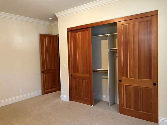 Bedroom 1 and large, organized, well-lit closet. 