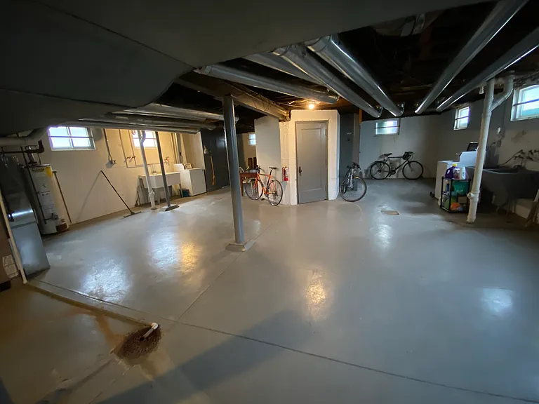 Very clean laundry room with individual storage units