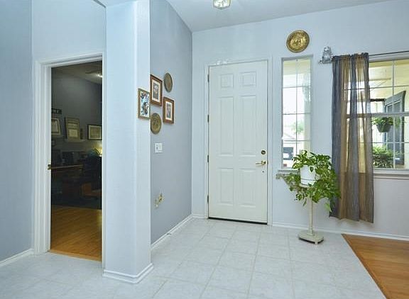 An eight-foot entry door invites you inside, where ten-foot ceilings make this Pecos plan unique from most others!