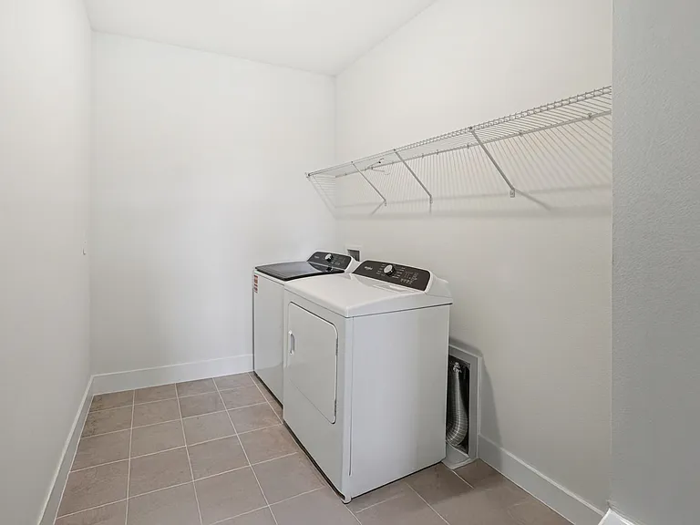 Large laundry room. Sink/cabinet will be installed.