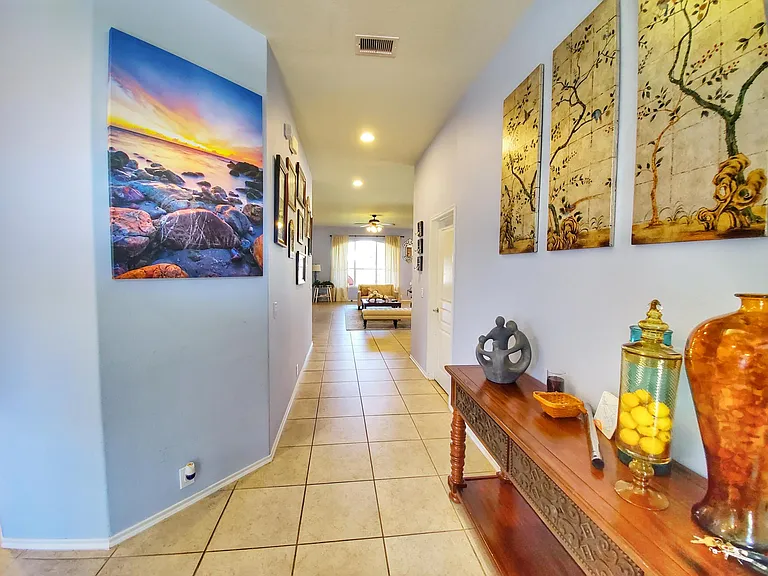 Foyer leads into well lit living area
