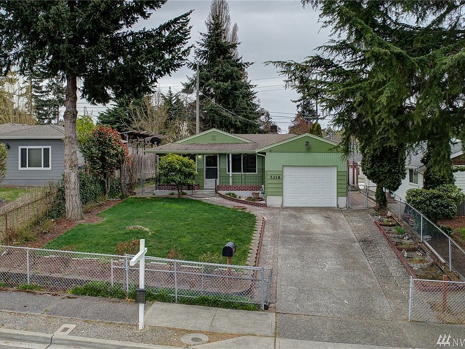 Character abounds in this charming Mid-Century Home! Covered front porch with brick accents & wrought iron railings. Lot's of landscaping details for those Gardner enthusiasts. Fully fenced yard with sliding chain link driveway closer.