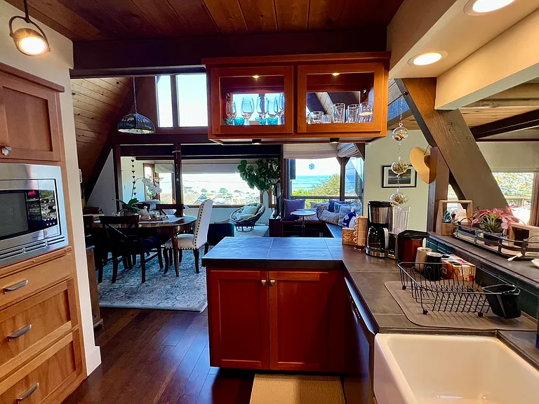This home has so many amazing view corridors, from the east side of the kitchen looking west to the ocean.