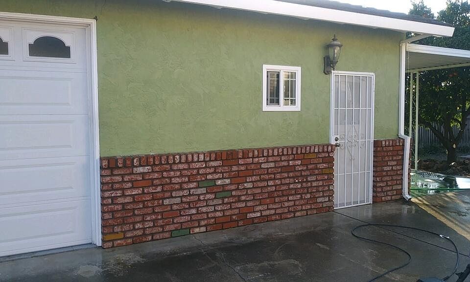 picture of the front door. Your car would be parked in a secure long driveway right next to your front door here. Private patio behind with covered area and orange grove tree.