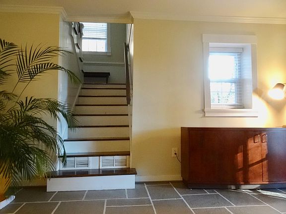 living room and staircase to bedroom and toilet