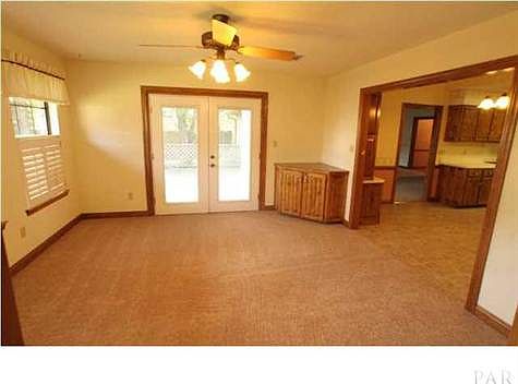 Cozy sunroom off the Kitchen and side entry to back porch.