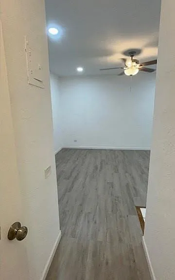 Very Large Living Room - wood panel floors, ceiling lighting, remodeled