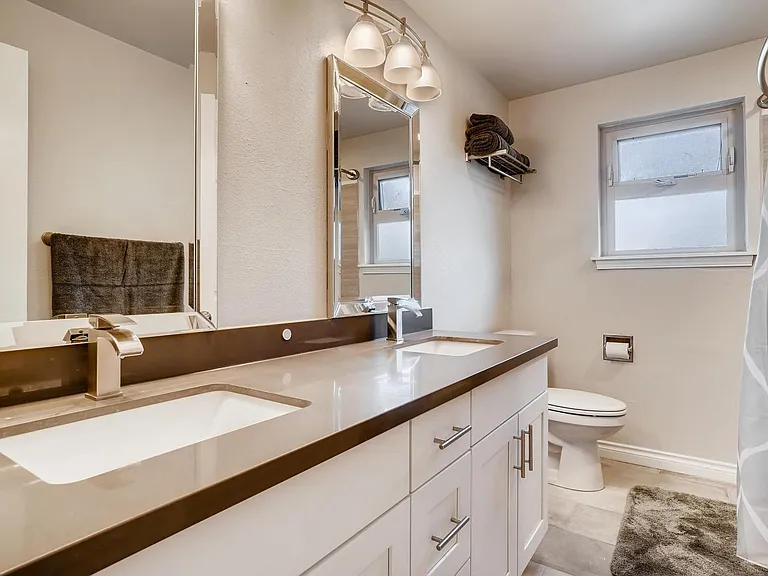 Upstairs Full Bathroom with double vanity and bathtub/shower