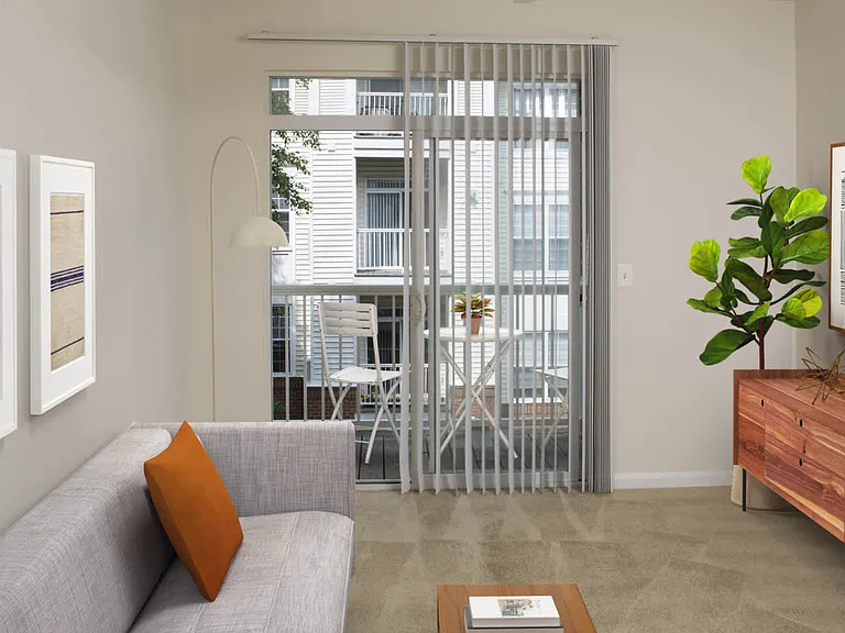 Carpeted Living Area with Balcony