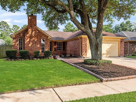 The large tree add an abundance of shade and character to the front of the home.