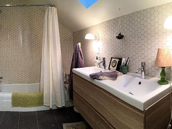 New bathroom with great shower / tub and a nice double vanit