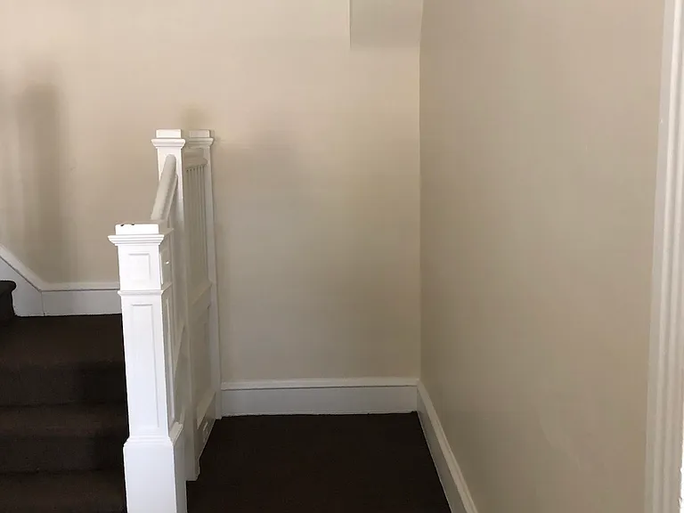 Living room next to stairs