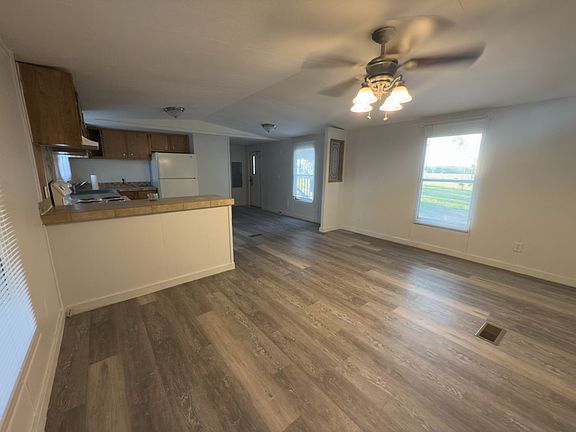 Living area and kitchen. View from front door.