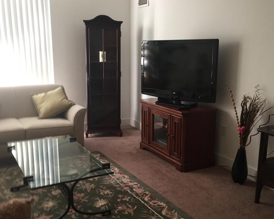 living room with floor to ceiling window
