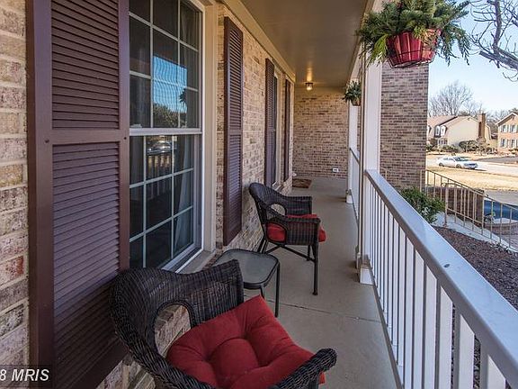 TIME TO RELAX ON YOUR CHARMING COVERED FRONT PORCH