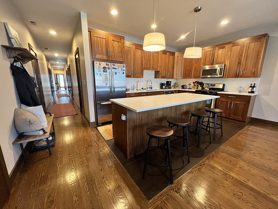 Quartz kitchen counters, island, custom lighting, DW