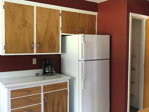 Coffee maker and large pantry.