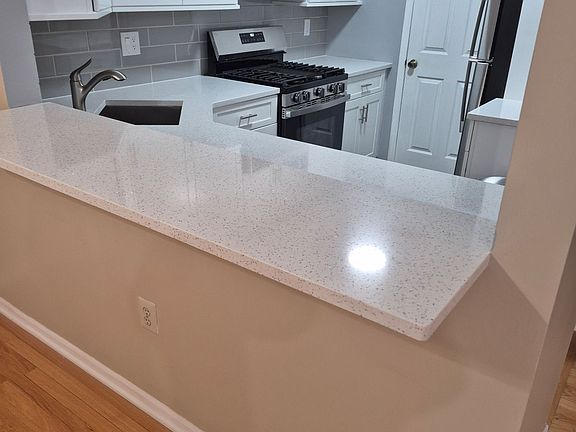 Breakfast Bar in Dining Area Looking into Kitchen