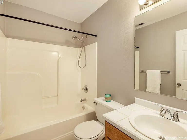 Second full bathroom on the upper floor with bath- tub and vanity