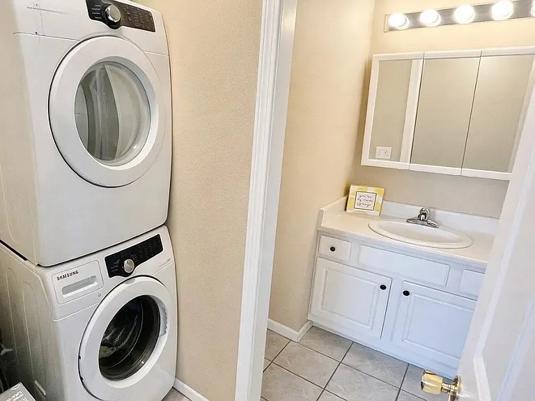 Laundry and powder room off kitchen on main level.
