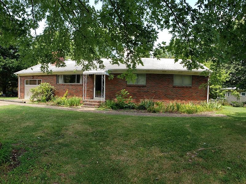 Brick home, quiet street.