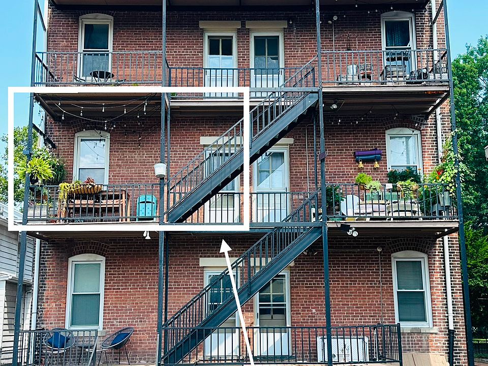 Back porch/fire escape with ample opportunities for urban gardening and entertaining.