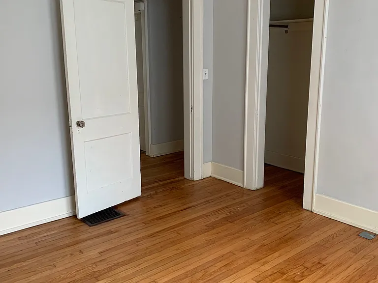 2nd bedroom with view of closet and hall