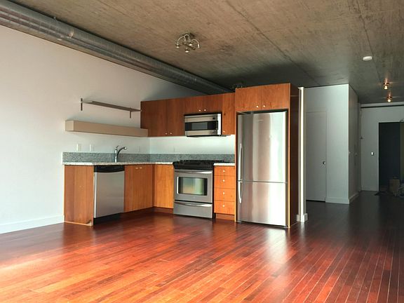 Brazilian cherry floors, granite countertops, and stainless