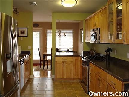 Updated Kitchen cabinets, tile, stainless