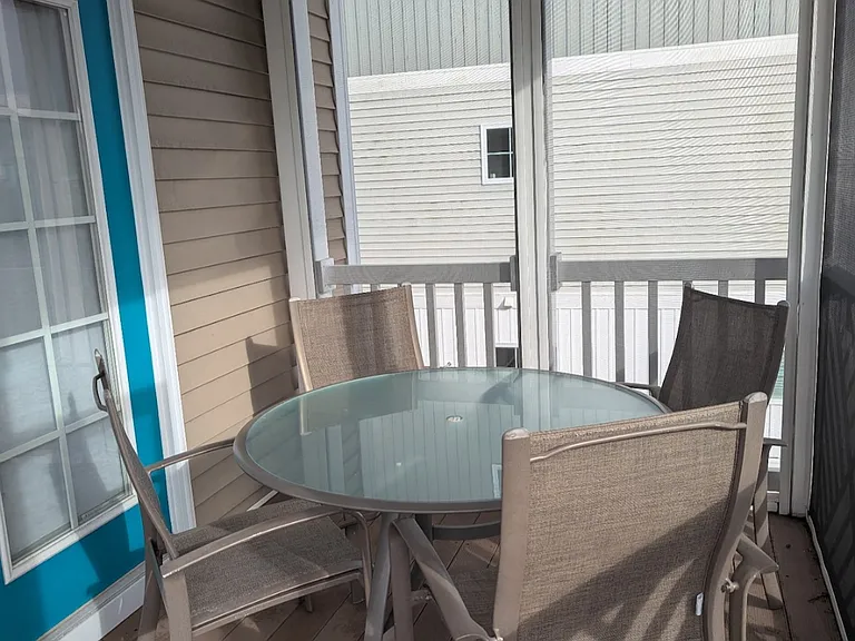 Screened in porch overlooking the backyard