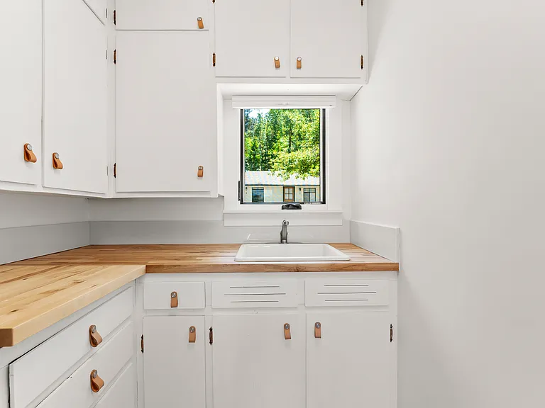 Kitchen has tons of storage and new stainless appliances.