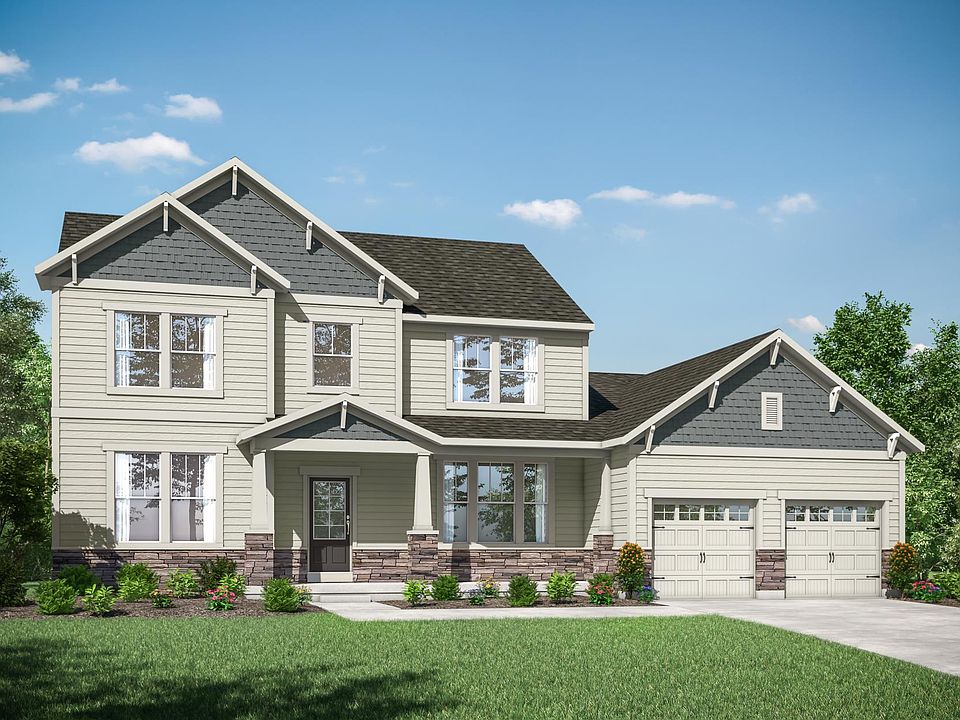 two-story home with siding, stone and shakes