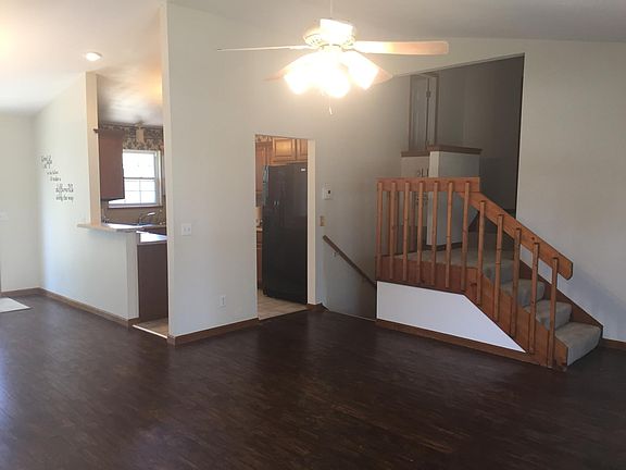 Stairs leading up go to full guest bath and 2 guest bedroom and another master bedroom with attached full bath.